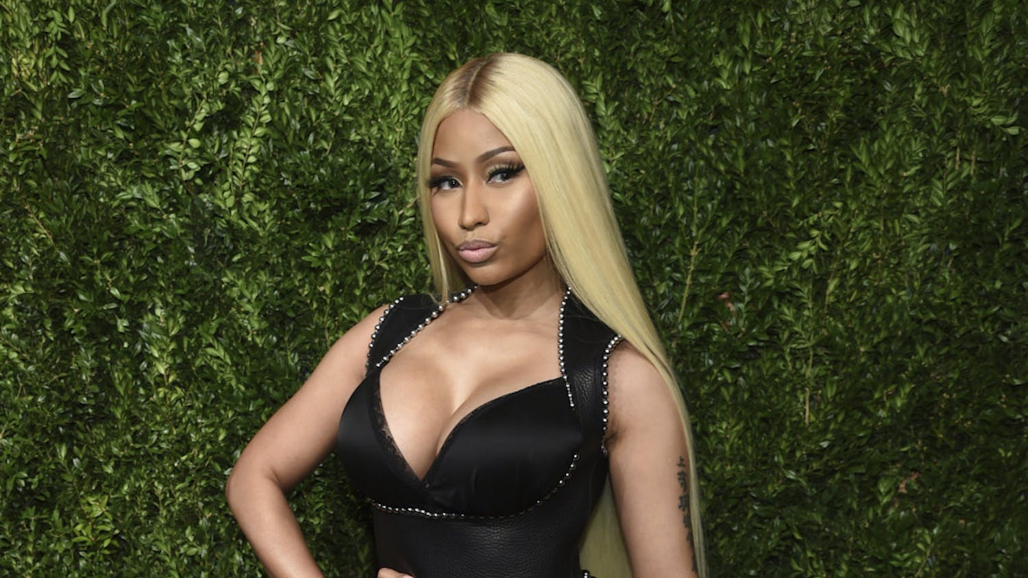 FILE - This Nov. 6, 2017 file photo shows Nicki Minaj at the 14th Annual CFDA Vogue Fashion Fund Gala in New York. The chart-topping rapper announced Thursday, Sept. 5, 2019, on Twitter that she “decided to retire & have my family.” In the tweet, Minaj she took a jab at her critics and asked her fans to “keep reppin me, do it til da death of me.” In July, Minaj announced she was pulling out a show in Saudi Arabia to show support women's rights, gay rights and freedom of expression. She also canceled her appearance at the BET Experience Concert earlier this year. (Photo by Evan Agostini/Invision/AP, File)