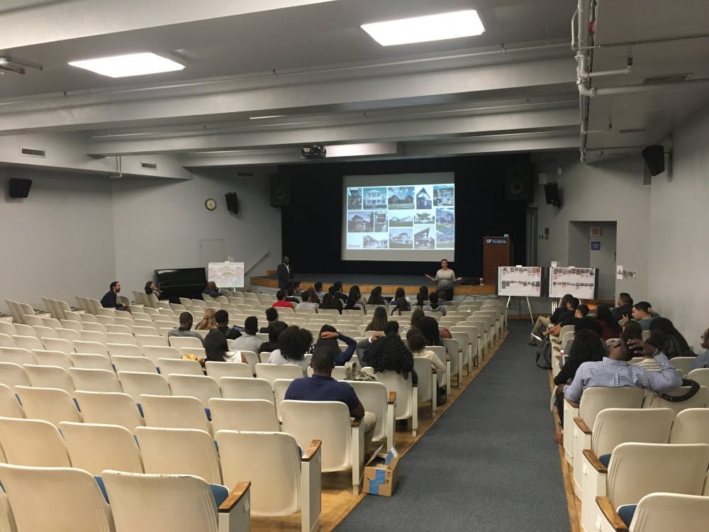 UF students sit in the Reitz Union Grand Ballroom on Thursday night to discuss plans to rebuild La Casita and the Institute of Black Culture. Construction will begin in Summer and end Spring 2018.