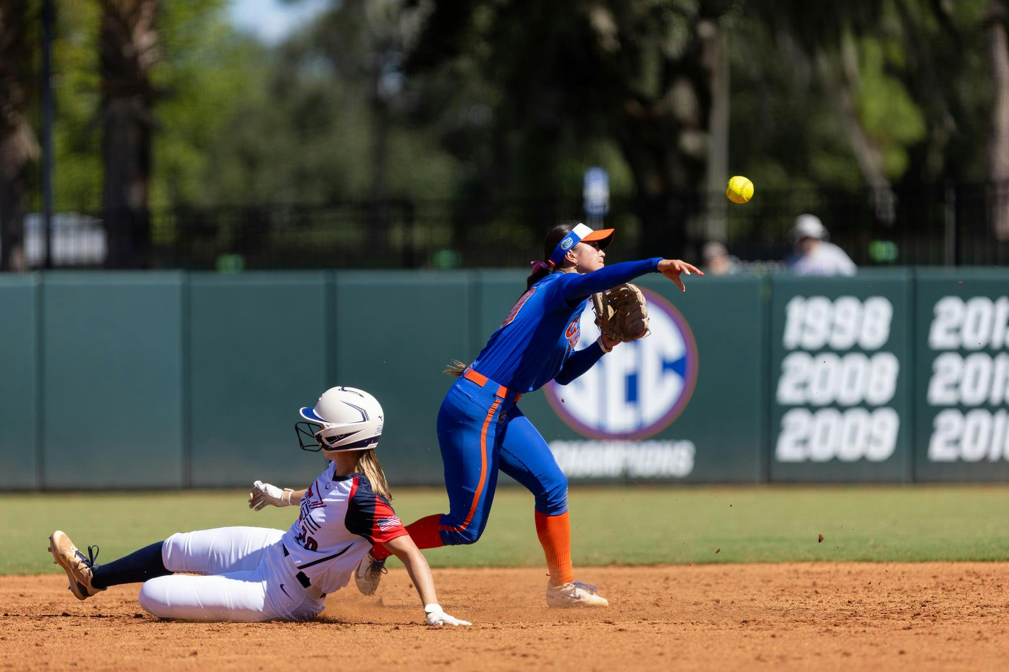 Florida Gators infielder Gabi Comia (10) turns a double play during the team's game against the Florida Vibe on Sunday, Oct. 12, 2025.