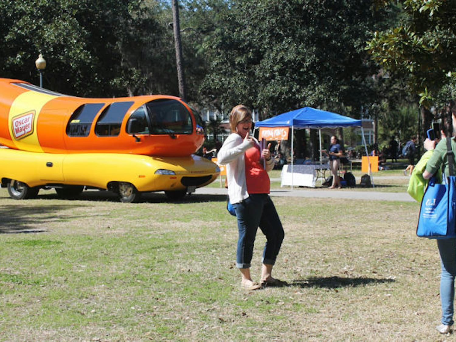 &nbsp;
Kristina Dorman, an 18-year-old UF elementary education junior, takes a picture of 21-year-old Calie Hinnrichs, also an elementary education junior, with the Oscar Mayer Wienermobile on the Plaza of the Americas Wednesday.