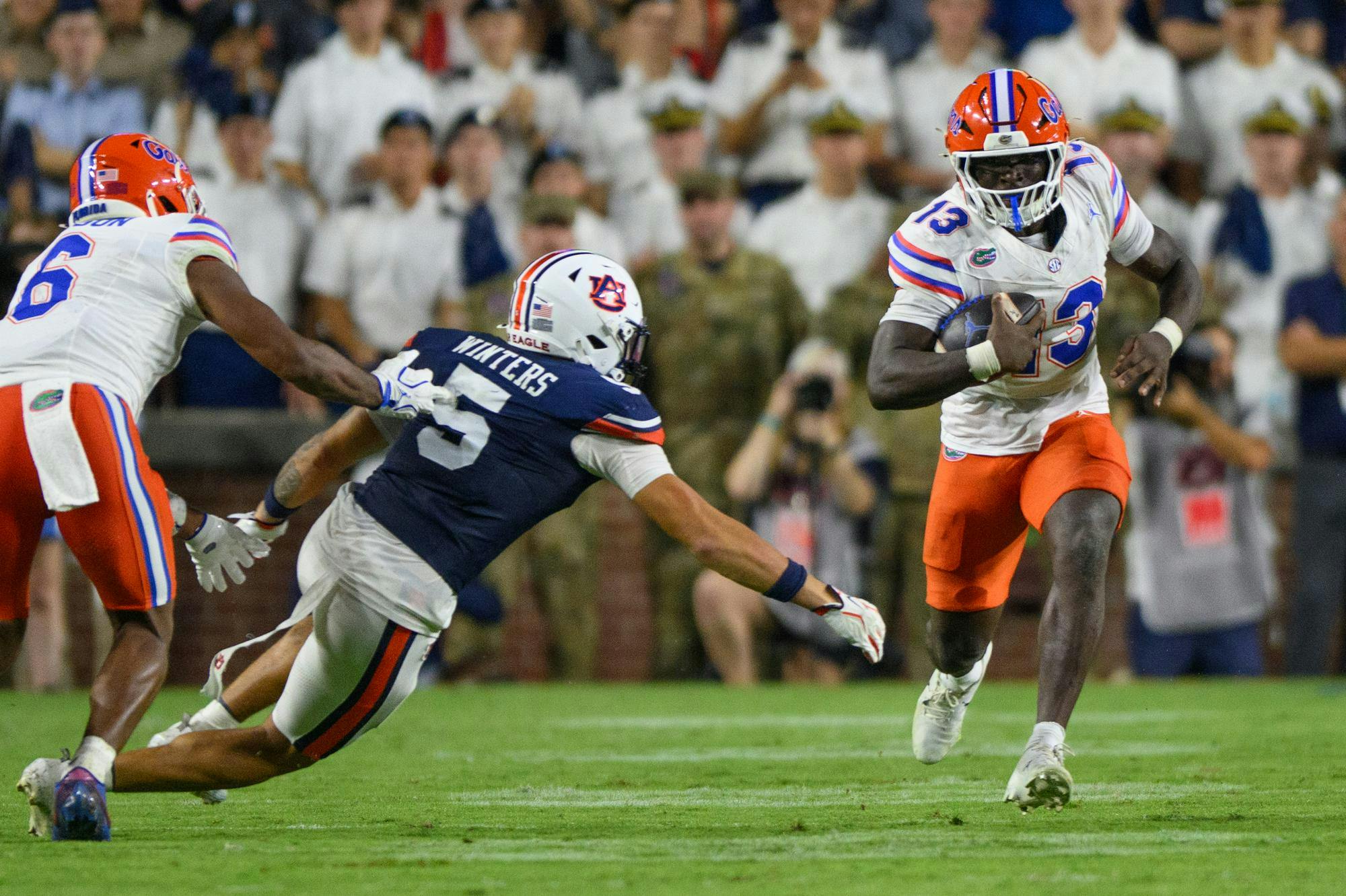Florida running back Jadan Baugh (13) rushes during the first half of an NCAA college football game against Auburn, Saturday, Sept. 19, 2026, in Auburn, Ala.