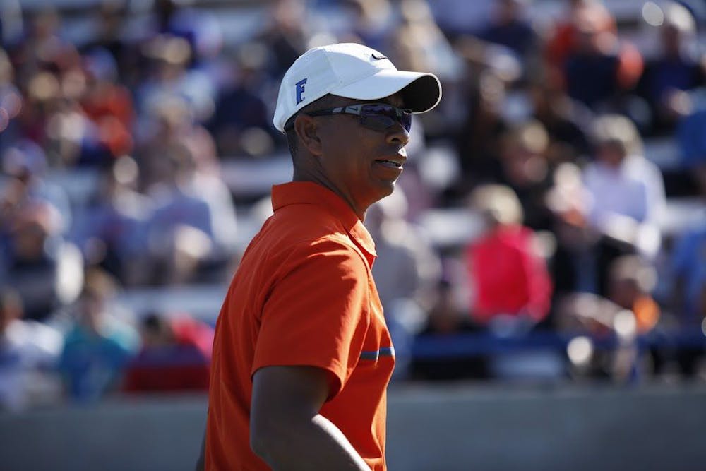 <p>UF men's tennis coach Bryan Shelton looks on during Florida's 4-2 win against UCLA on Feb. 5, 2017, at the Ring Tennis Complex.</p>