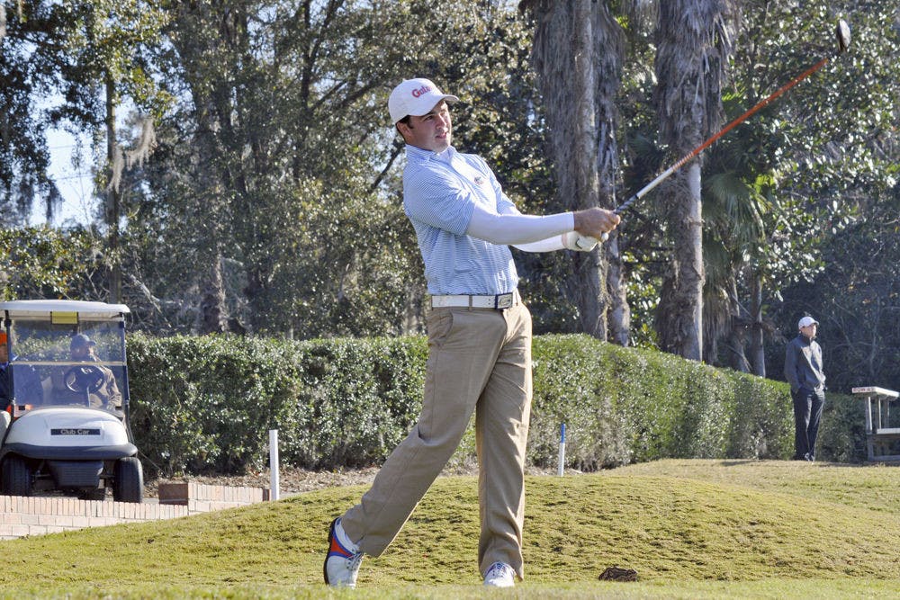 UF's A.J. Crouch follows through on his backswing at the 2015 SunTrust Gator Invitational on Feb. 14, 2015 at the Mark Bostick Golf Course.&nbsp;