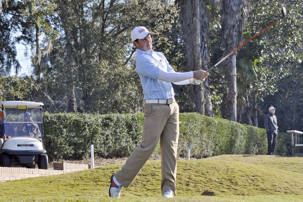 <p>UF's A.J. Crouch follows through on his backswing at the 2015 SunTrust Gator Invitational on Feb. 14, 2015 at the Mark Bostick Golf Course.&nbsp;</p>