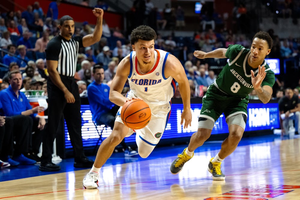 <p>Florida Gators guard Walter Clayton Jr. (1) drives with the basketball in a game against the Jacksonville Dolphins in Gainesville, Florida, on November 8, 2024.</p>