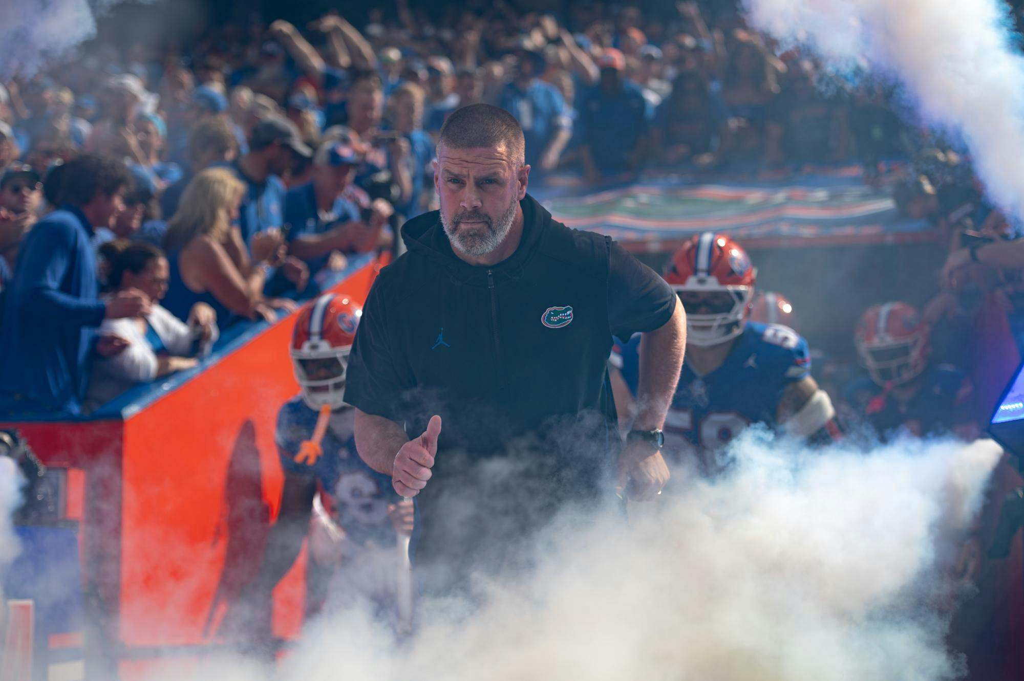 Florida Gators head coach Billy Napier runs through the tunnel at Ben Hill Griffin Stadium before the Florida Gators play the Texas Longhorns on Oct. 4, 2025 in Gainesville, Fla.