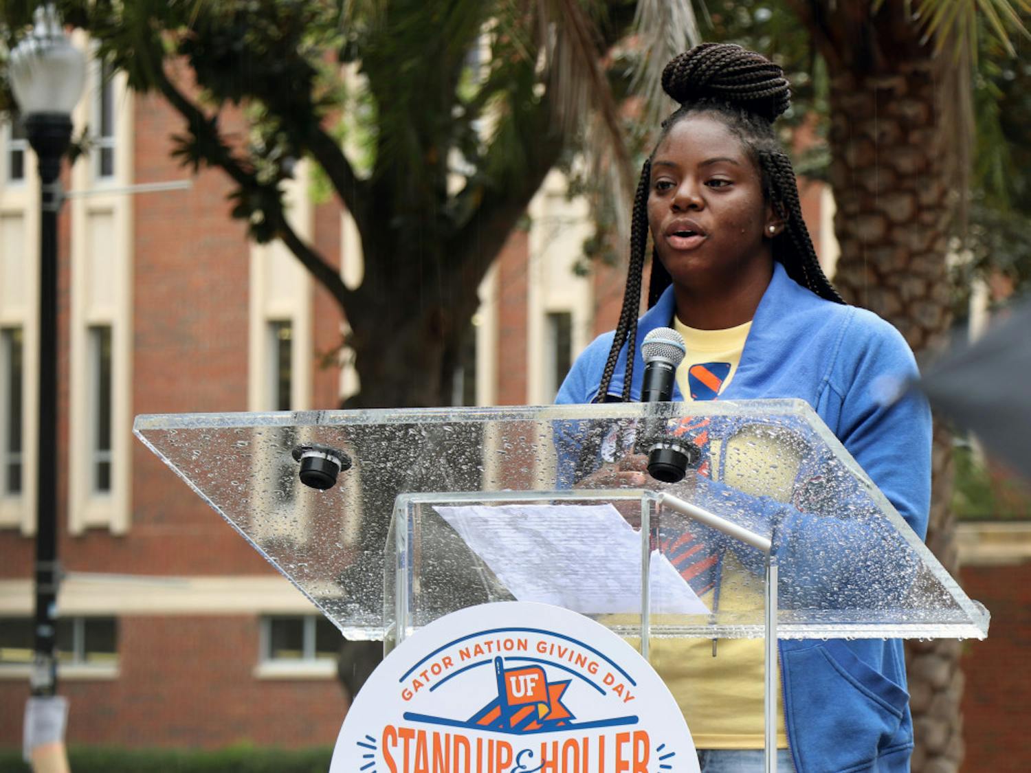 Akiya Parks, a first-generation student and Machen Florida Opportunity Scholar, addresses the crowd on the Plaza of the Americas Feb. 26, 2019, for the “Stand Up and Holler: Gator Nation Giving Day.”