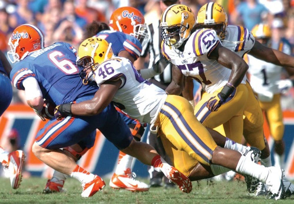 <p>Quarterback Jeff Driskel (6) is sacked by LSU linebacker Kevin Minter (46) during Florida’s 14-6 win on Saturday in Ben Hill Griffin Stadium. Driskel completed 8 of 12 passes for 61 yards. He finished with 1 yard rushing on 13 carries despite losing 43 yards on five sacks.&nbsp;</p>
<div><span><br /></span></div>
