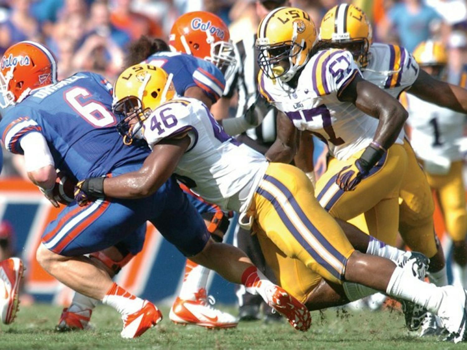 Quarterback Jeff Driskel (6) is sacked by LSU linebacker Kevin Minter (46) during Florida’s 14-6 win on Saturday in Ben Hill Griffin Stadium. Driskel completed 8 of 12 passes for 61 yards. He finished with 1 yard rushing on 13 carries despite losing 43 yards on five sacks.&nbsp;
