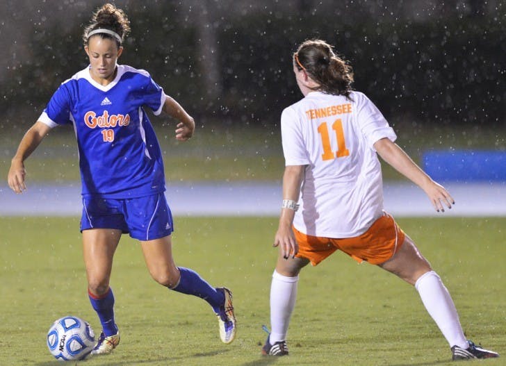 Havana Solaun (19) moves past Tennessee midfielder Alison Clarke (11) at James G. Pressly Stadium.&nbsp;