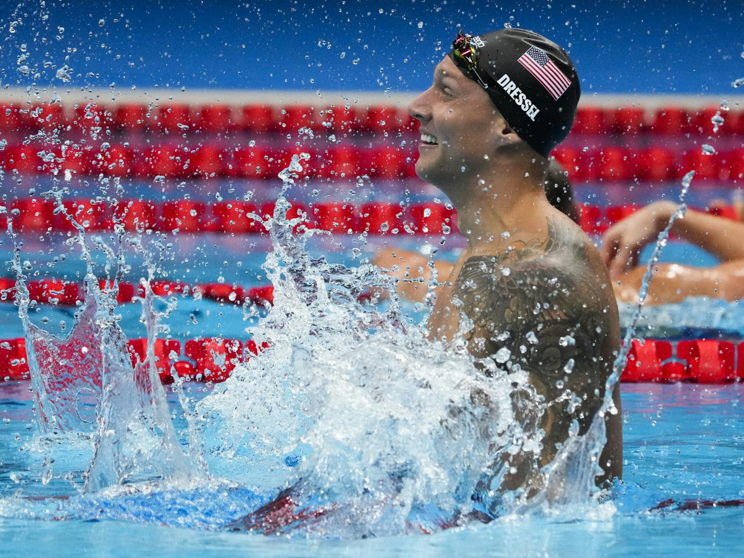 Caeleb Dressel, of the United States, celebrates after winning the men's 100-meter freestyle final at the 2020 Summer Olympics, Thursday, July 29, 2021, in Tokyo, Japan. (AP Photo/Charlie Riedel)