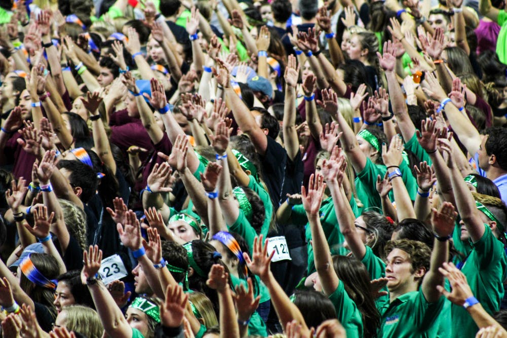 <p dir="ltr"><span>Dancers raise their hands during a dance number at 2017's Dance Marathon at the O'Connell Center. Dance Marathon raises money and awareness for Children's Miracle Network.</span></p><p><span> </span></p>