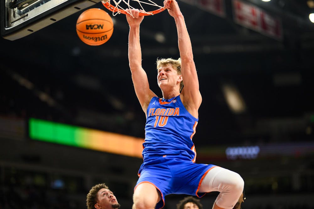 Florida forward Thomas Haugh (10) dunks during the first half of an NCAA college basketball game against South Carolina, Wednesday, Jan. 28, 2026, in Columbia, S.C.