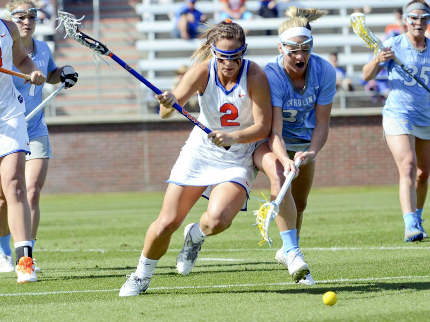 Sophomore attacker Sammi Burgess fights for a ground ball during UF's 17-11 loss to UNC at Donald R. Dizney Stadium.