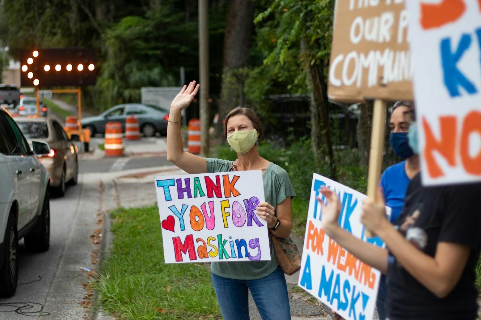 Kristen Grace participates in the pro-mask demonstration put on by parents as children arrive at P.K. Yonge Developmental Research School Monday, Aug. 16, 2021. She said it is frustrating that P.K. Yonge cannot have a mask mandate because it is affiliated with the University of Florida and must follow its rules. 