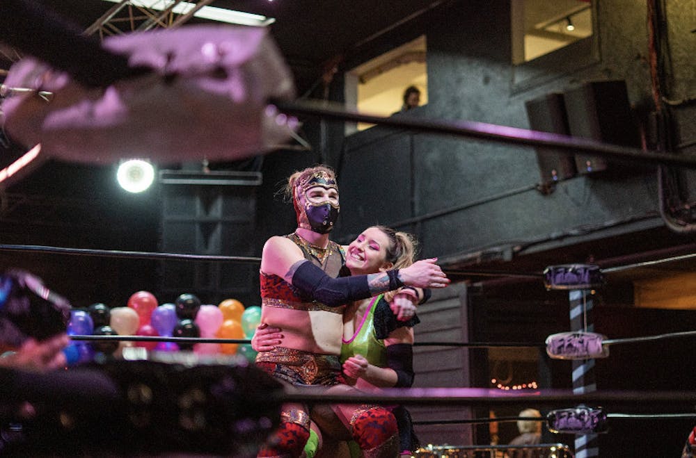 <p>Edith Surreal and Erica Leigh embrace each other in the ring during “Love is a Battlefield II: Electric Boogaloo” Saturday at Knockin’ Boots Saloon. </p>