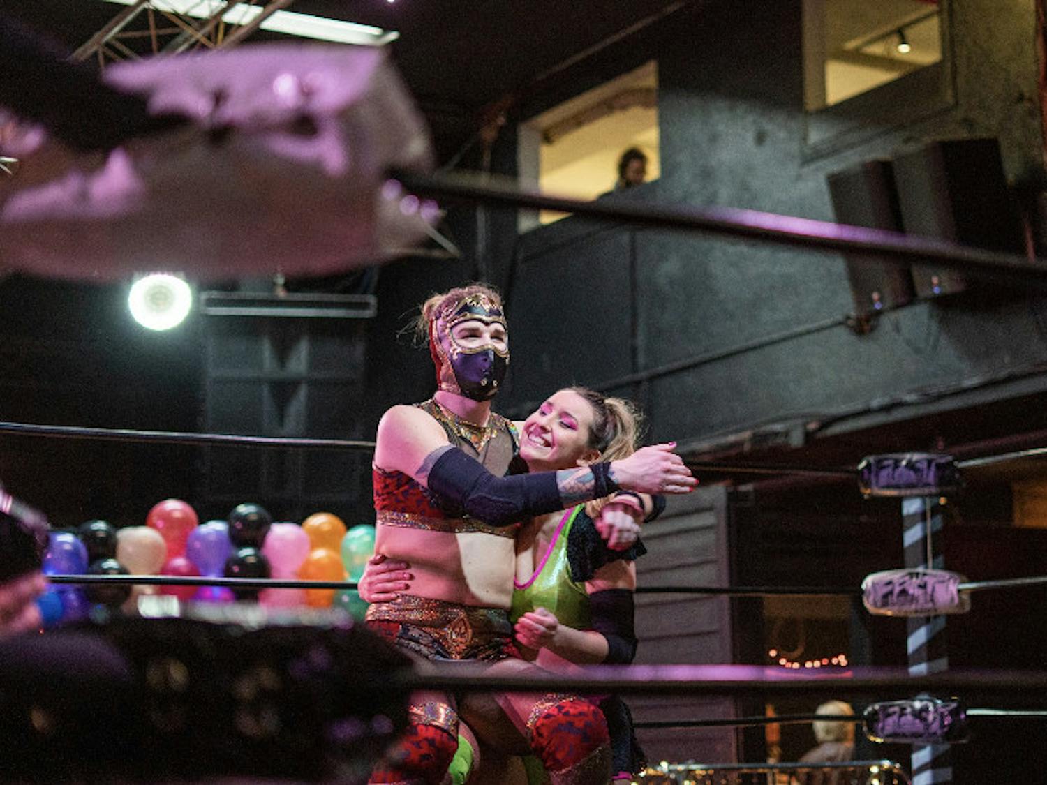 Edith Surreal and Erica Leigh embrace each other in the ring during “Love is a Battlefield II: Electric Boogaloo” Saturday at Knockin’ Boots Saloon.