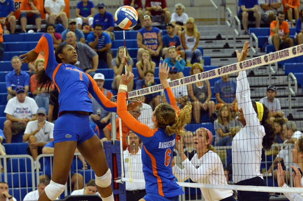 <p>Freshman middle blocker Rhamat Alhassan swings for a kill during Florida's 3-0 win against Georgia Southern on Aug. 29 in the O'Connell Center.</p>