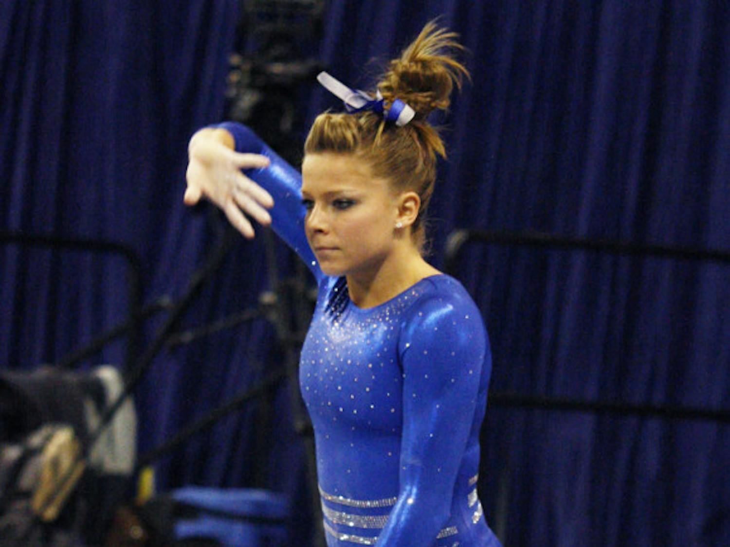 Mackenzie Caquatto performs on the beam during UF’s 196.575-190.55 win against Ball State on Jan. 4 in the O’Connell Center.
