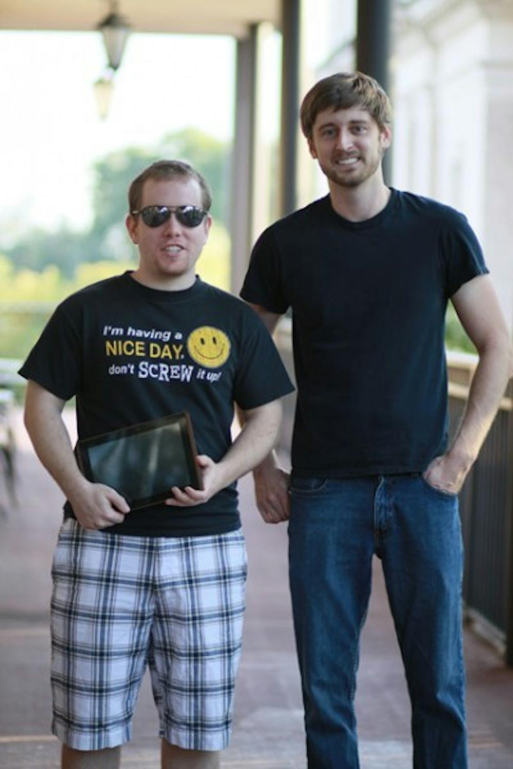 <p>UF alumni Matthew Carroll, left, and Garrett Strobel, right, started Niche Mobile. The company specializes in cellular phone applications.</p>