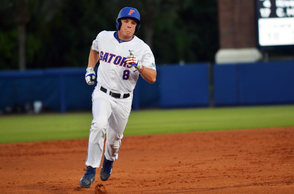Outfielder Harrison Bader rounds the bases after hitting a solo home run in the first inning of Florida's 14-3 win against South Carolina on April 10 at McKethan Stadium.