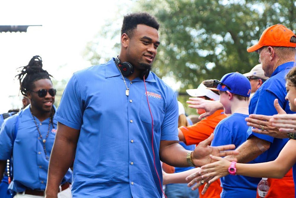 <p>Former UF defensive lineman Caleb Brantley greets fans prior to Florida's 32-0 win over North Texas on Sept. 17, 2016, at Ben Hill Griffin Stadium.</p>