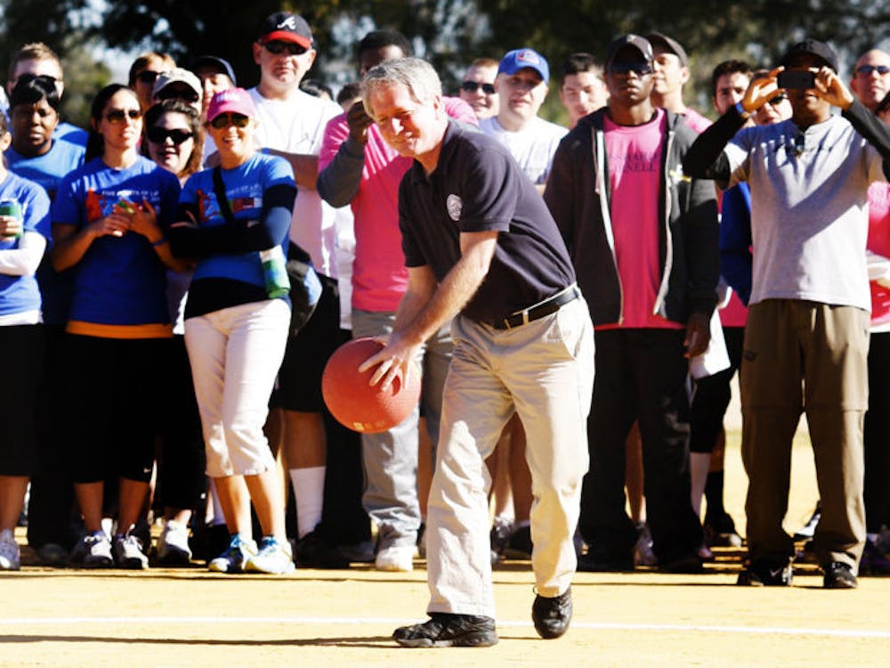 <p>Gainesville Mayor Craig Lowe makes the opening pitch at the 2013 Alachua County Emerging Leaders Champions for Charity kickball tournament. The mayor pitched the opening kickball to Newberry Mayor Bill Conrad. The tournament collected about $11,600.</p>