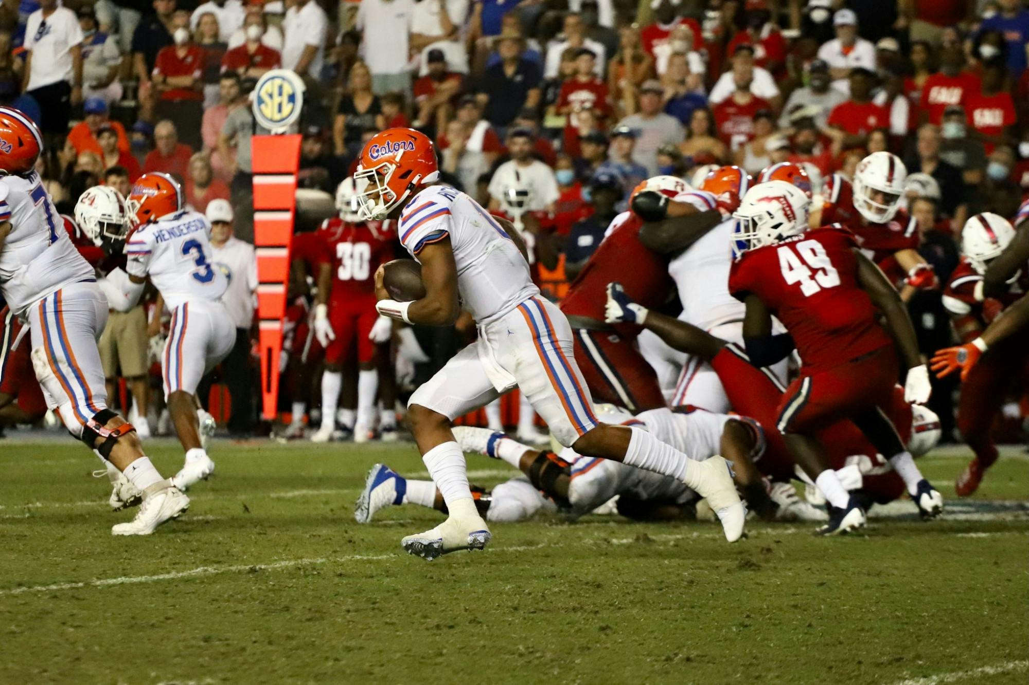 Quarterback Anthony Richardson scrambles against the FAU Owls. Richardson carried the ball seven times for 160 yards in the 35-14 win Saturday.