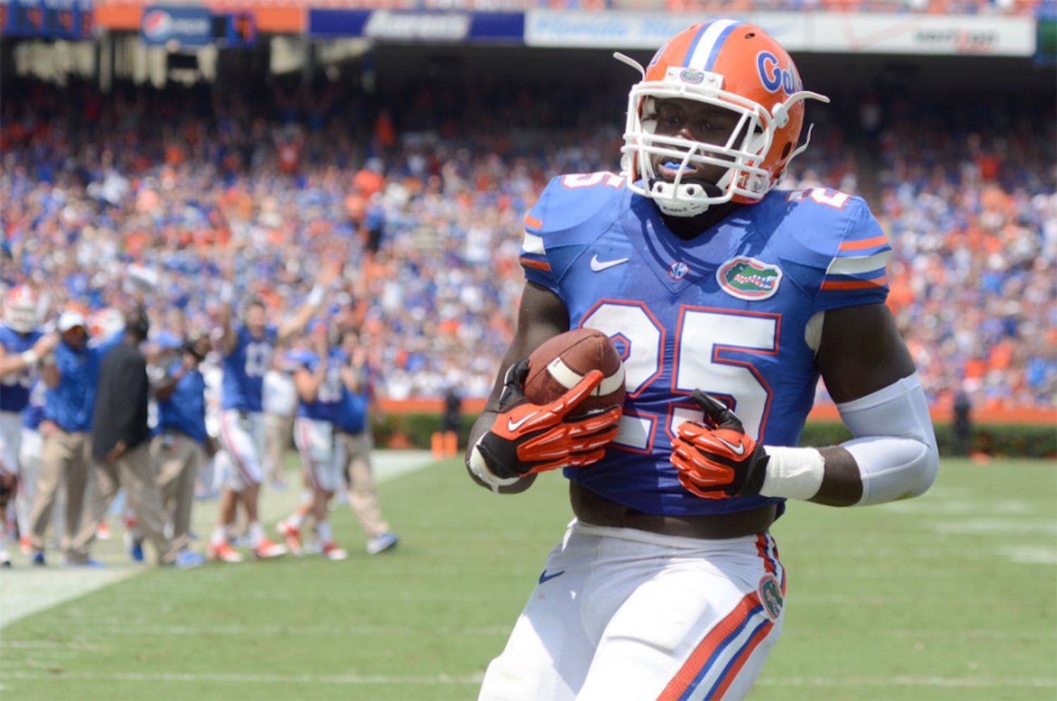 Fullback Gideon Ajagbe scores the first touchdown of his Gators career during No. 10 Florida's 24-6 win against Toledo on Saturday at Ben Hill Griffin Stadium. 