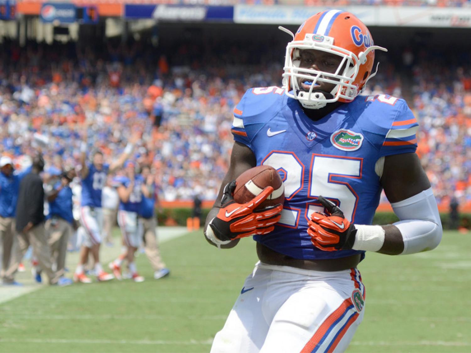 Fullback Gideon Ajagbe scores the first touchdown of his Gators career during No. 10 Florida's 24-6 win against Toledo on Saturday at Ben Hill Griffin Stadium.