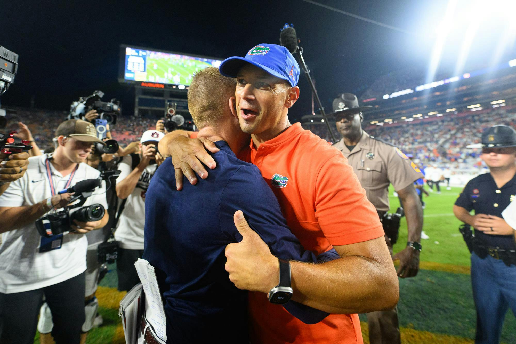 Florida head coach Jon Sumrall shakes hands with Auburn head coach Alex Golesh after winning an NCAA college football game, Saturday, Sept. 19, 2026, in Auburn, Ala.
