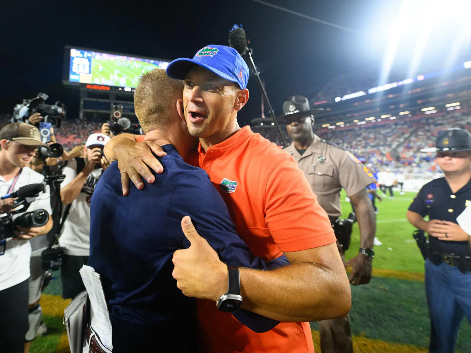 Florida head coach Jon Sumrall shakes hands with Auburn head coach Alex Golesh after winning an NCAA college football game, Saturday, Sept. 19, 2026, in Auburn, Ala.