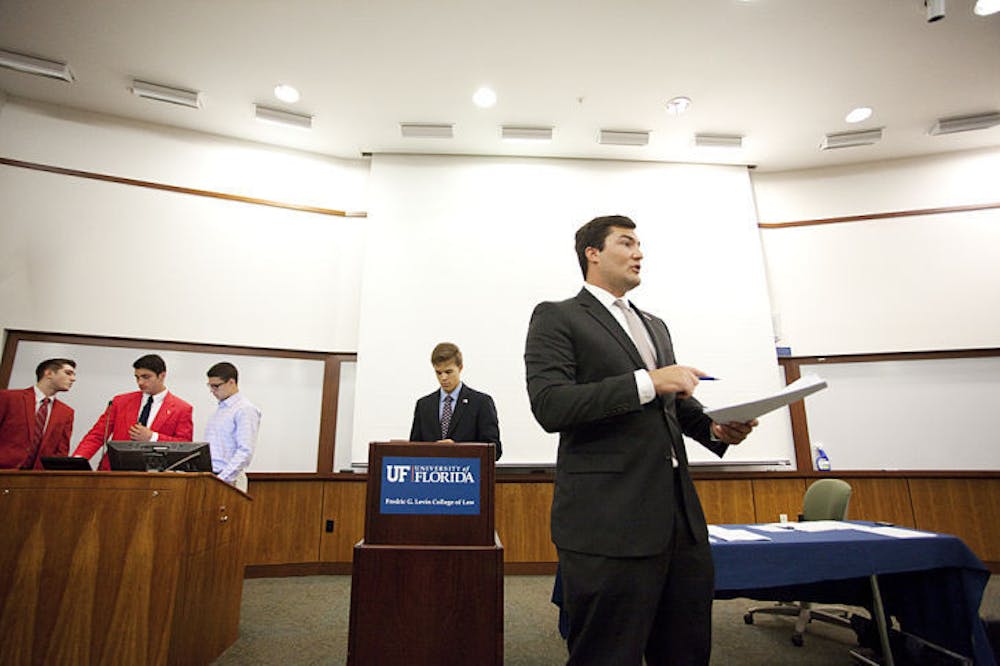 <p>Sen. Davis Bean, chair of the budget and allocations committee, presents the 2014-2015 budget at the Student Senate meeting Tuesday. The bill passed unanimously. &nbsp;</p>