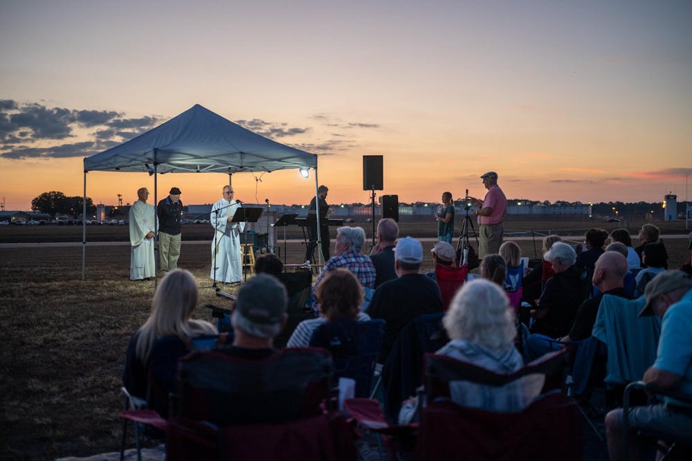 Protestors of the death penalty sit outside Florida State Prison and pray in opposition to the execution of Richard ​“Malik” Randolph. Randolph was executed in Raiford on Thursday, Nov. 20, 2025.