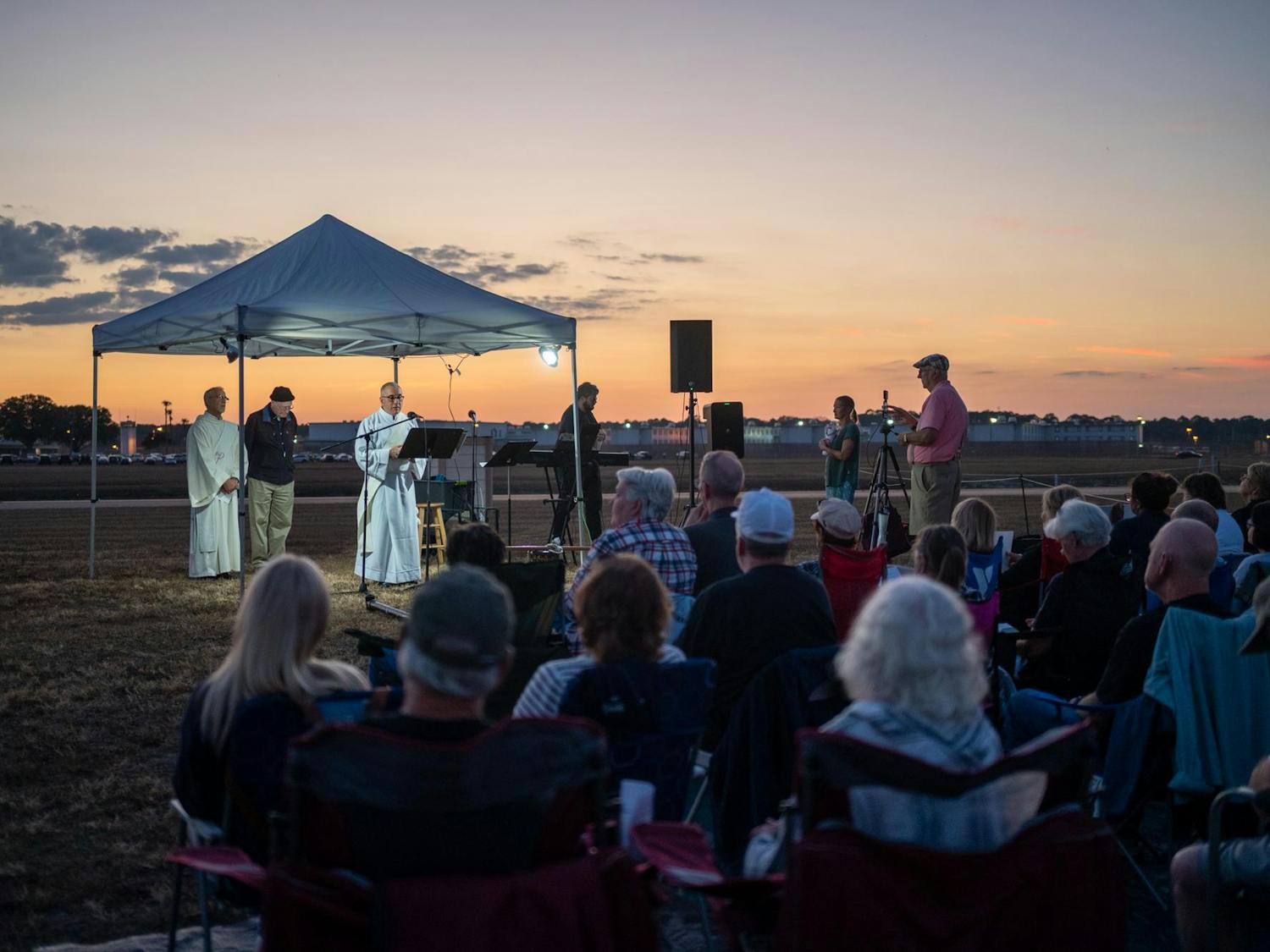 Protestors of the death penalty sit outside Florida State Prison and pray in opposition to the execution of Richard “Malik” Randolph. Randolph was executed in Raiford on Thursday, Nov. 20, 2025.