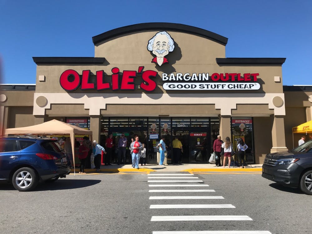Customers walk in and out of Ollie’s Bargain Outlet, in Northside Shopping Center, located at 2340 N Main St. The store opened Wednesday to hundreds of customers.  