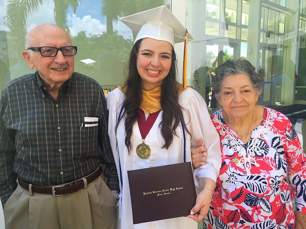 <p><span>Christina Morales with Abuelo and Ayaya at her 2016 high school graduation from Barbara Goleman Senior High at Florida International University. </span></p>