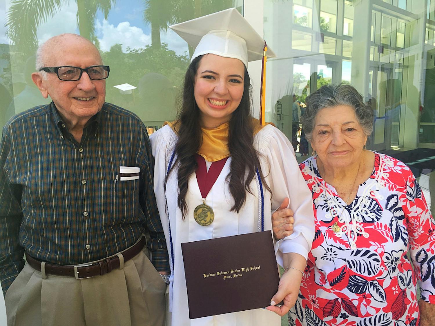 Christina Morales with Abuelo and Ayaya at her 2016 high school graduation from Barbara Goleman Senior High at Florida International University.