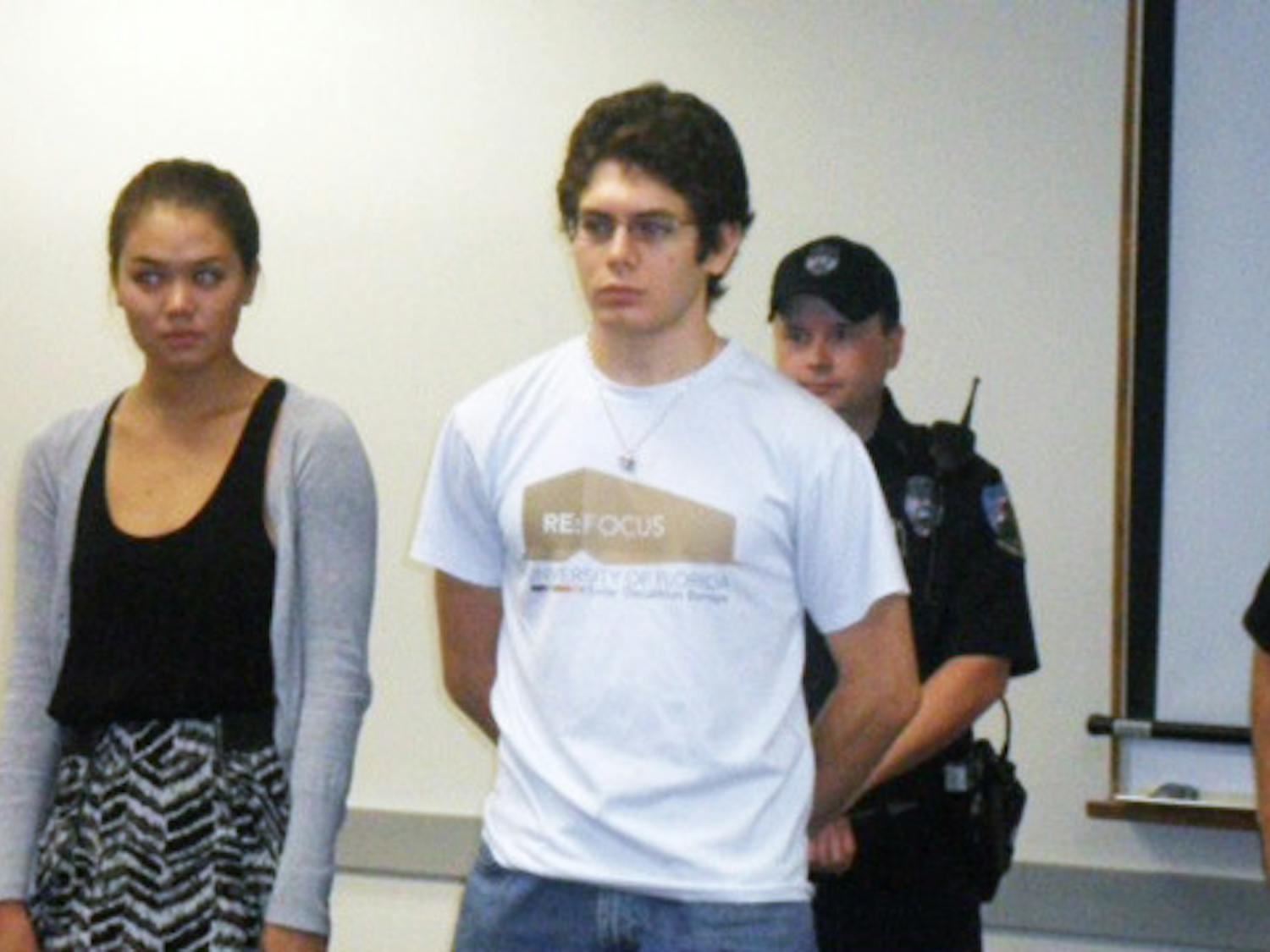 Lauren Mackie and David Wasserman are recognized at the UPD Advisory Council meeting Friday for helping save the life of an engineering professor.
