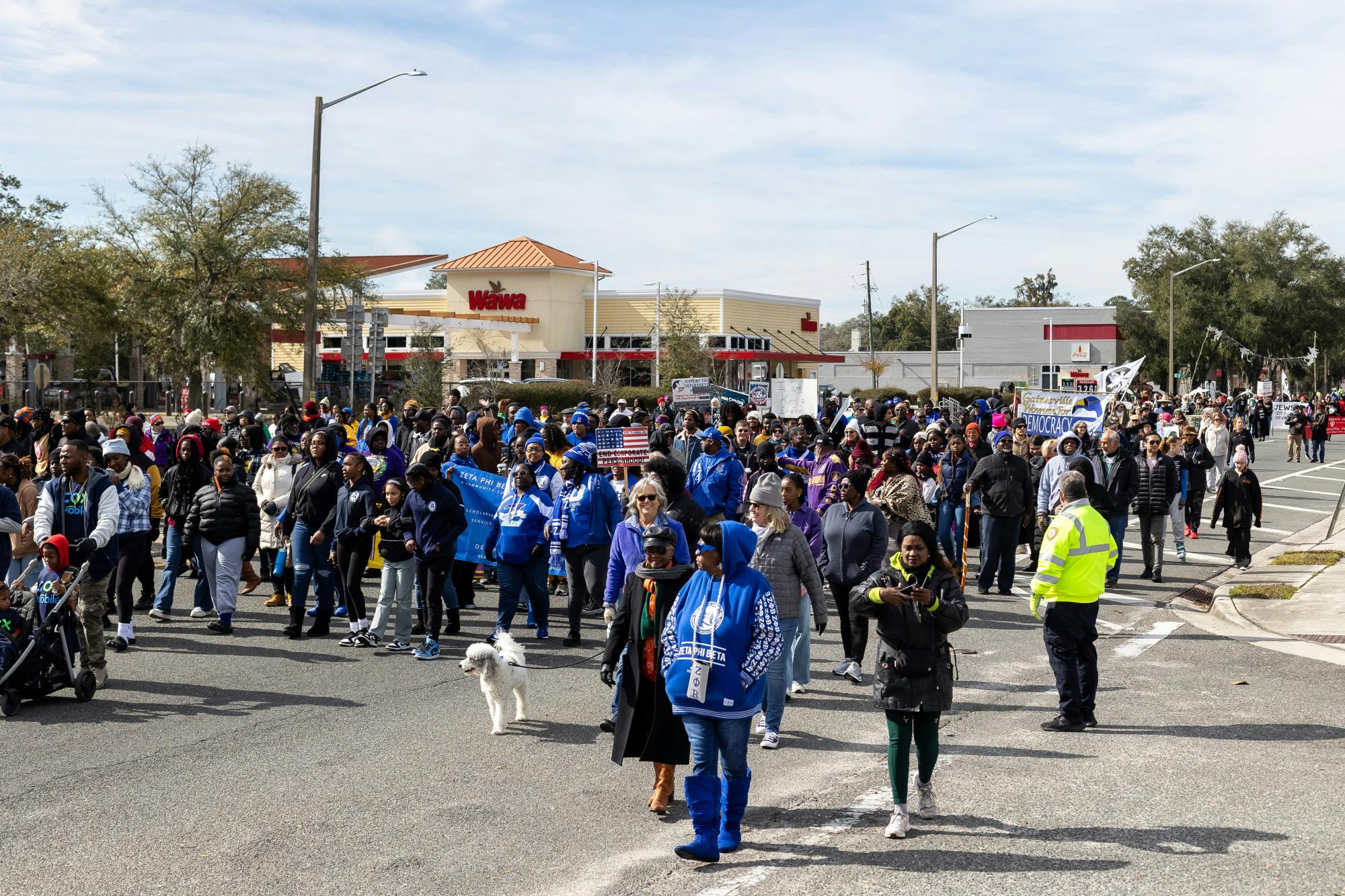 A crowd gathers for the MLK Day parade on University Avenue on Monday, January 20, 2025.