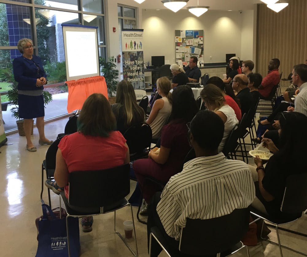 <p><span>Catherine Striley, a co-director of HealthStreet, gives a PowerPoint presentation on the dangers of opioid drugs to about 25 Gainesville residents</span> <span><span>on Wednesday</span></span> <span>evening ahead of a panel discussion live-viewing, hosted by the UF Health Community Engagement Center.</span></p>