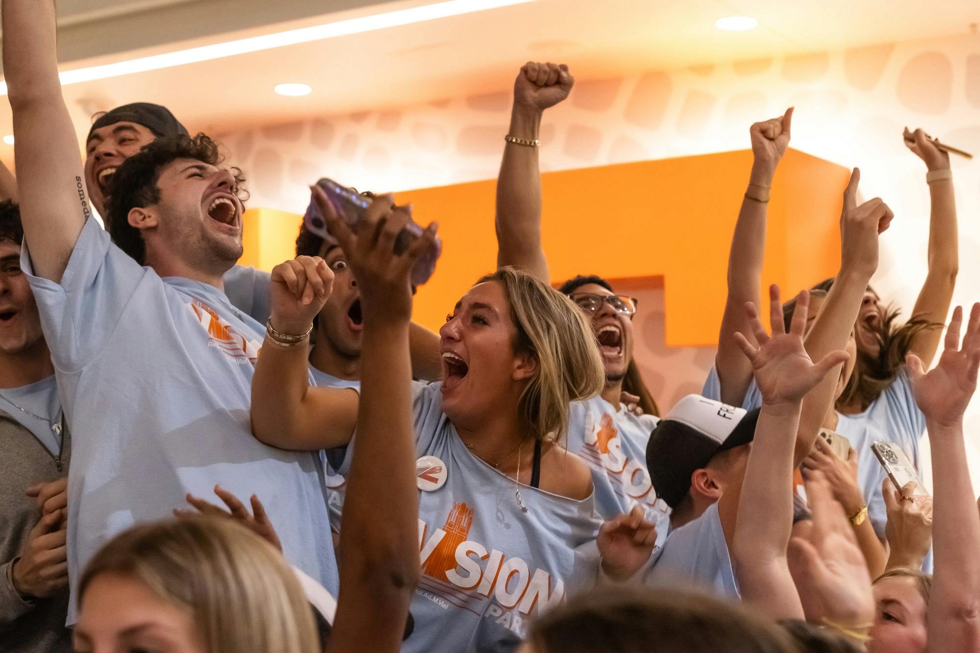 Vision Party campaign managers Freddi Rappoport and Aaron Amster celebrate SG election results at the Reitz Union on Oct. 14, 2024.