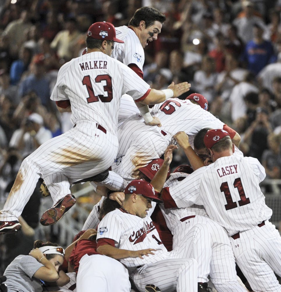 South Carolina players celebrate after beating Florida 5-2 in
Game 2 of the NCAA baseball College World Series best-of-three
finals.