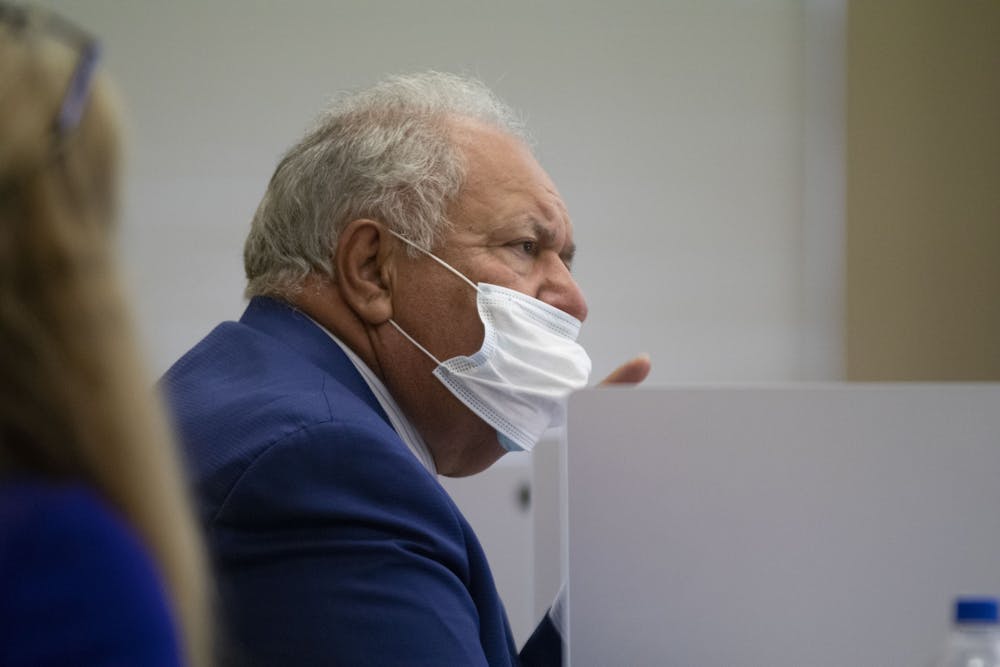 Chairman Mori Hosseini's mask slips down his face as he participates in the discussion after public comment. Later in the meeting, Hosseini removed his mask and talked at length while the board approved action items.