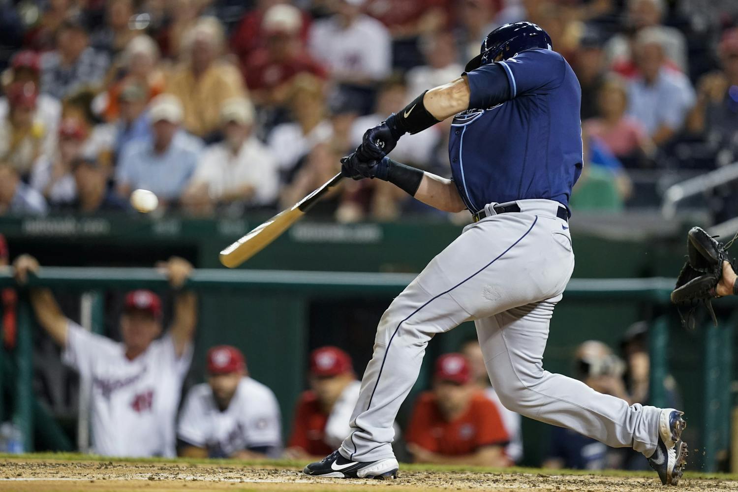 Tampa Bay Rays' Mike Zunino hits a solo home run during the ninth inning of a baseball game against the Washington Nationals at Nationals Park, Tuesday, June 29, 2021, in Washington. (AP Photo/Alex Brandon)