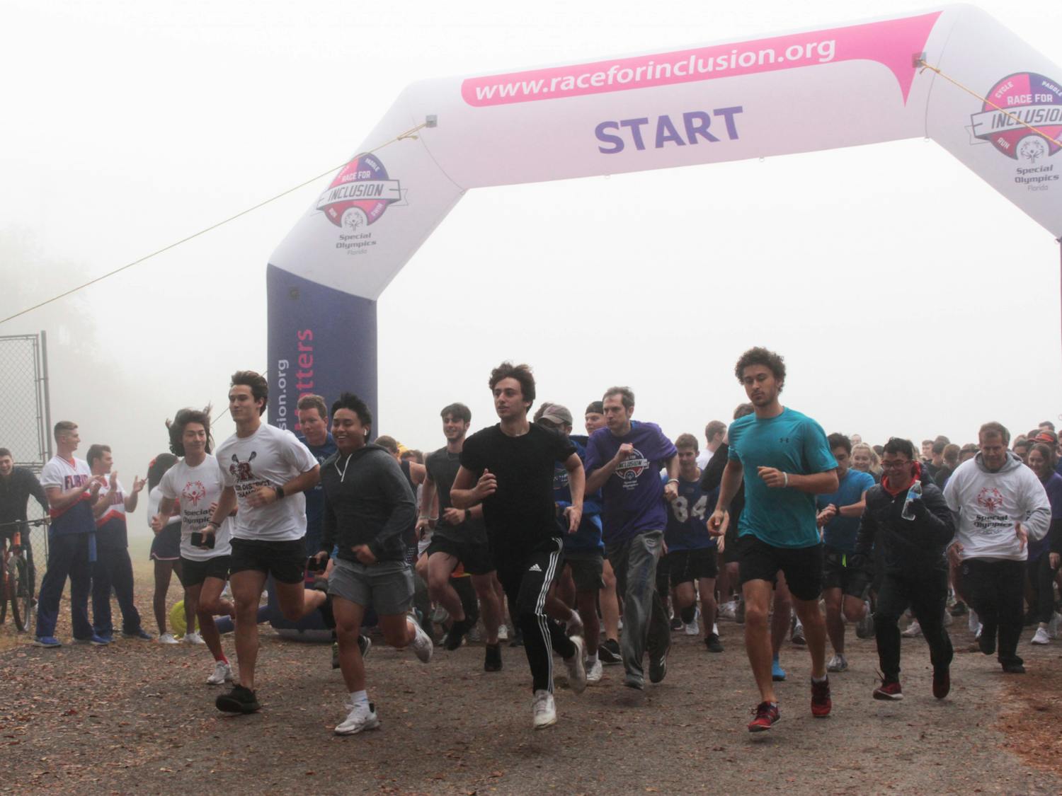 Participants start running during the Gainesville Race for Inclusion organized by Special Olympics Florida on Dec. 4, 2021. Nathan Grinalds came first in the race.
