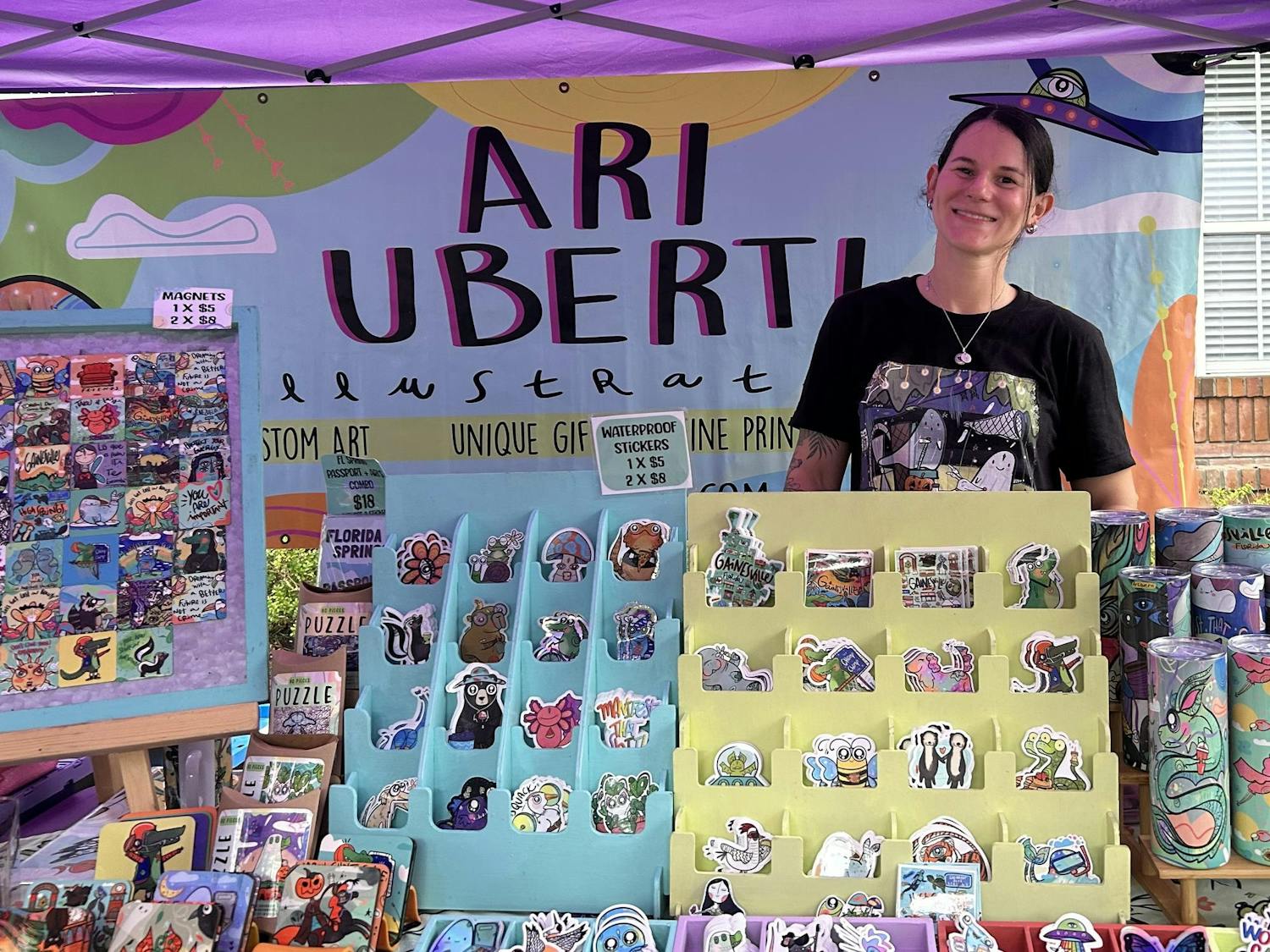 A regular at the Haile Farmers Market, held Saturdays from 8:30 a.m. to noon, Arianna León Uberti offers her colorful and cartoonish designs on stickers, magnets, water bottles, shirts and more.