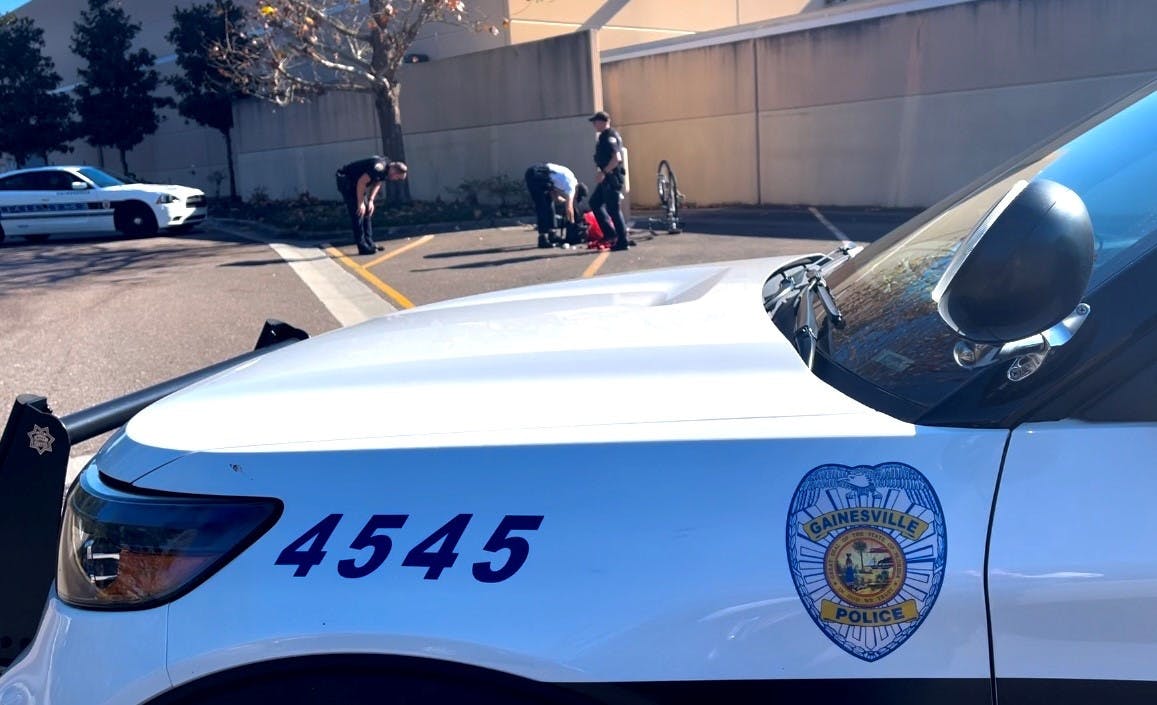 Gainesville police cars respond to a hit-and-run Tuesday, Jan. 10, 2023. ﻿
