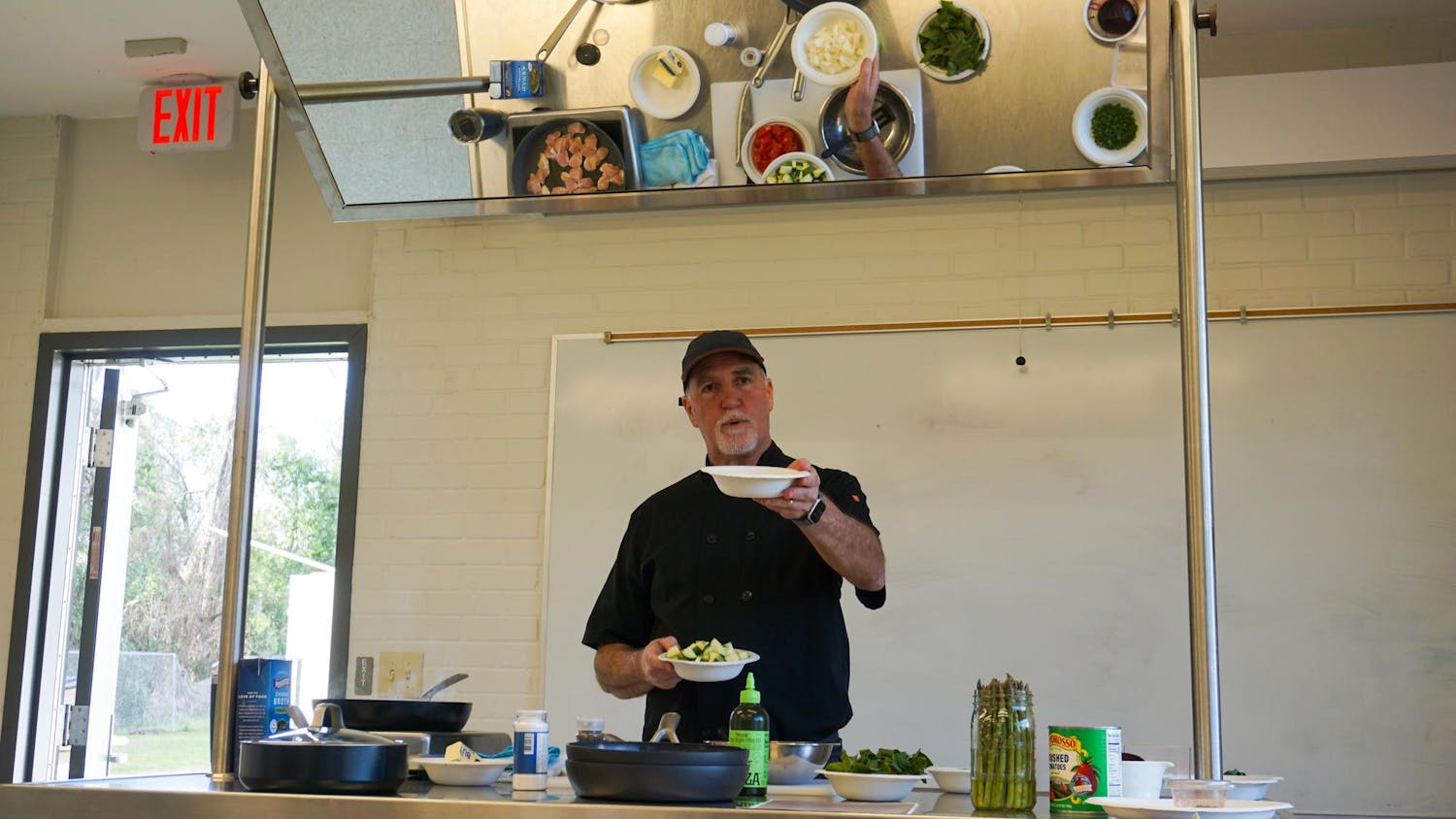 Chef Fred Cremo demonstrates how to cook vegetables at the Field & Fork Food Pantry, Wednesday, March 4, 2026, in Gainesville, Fla.
