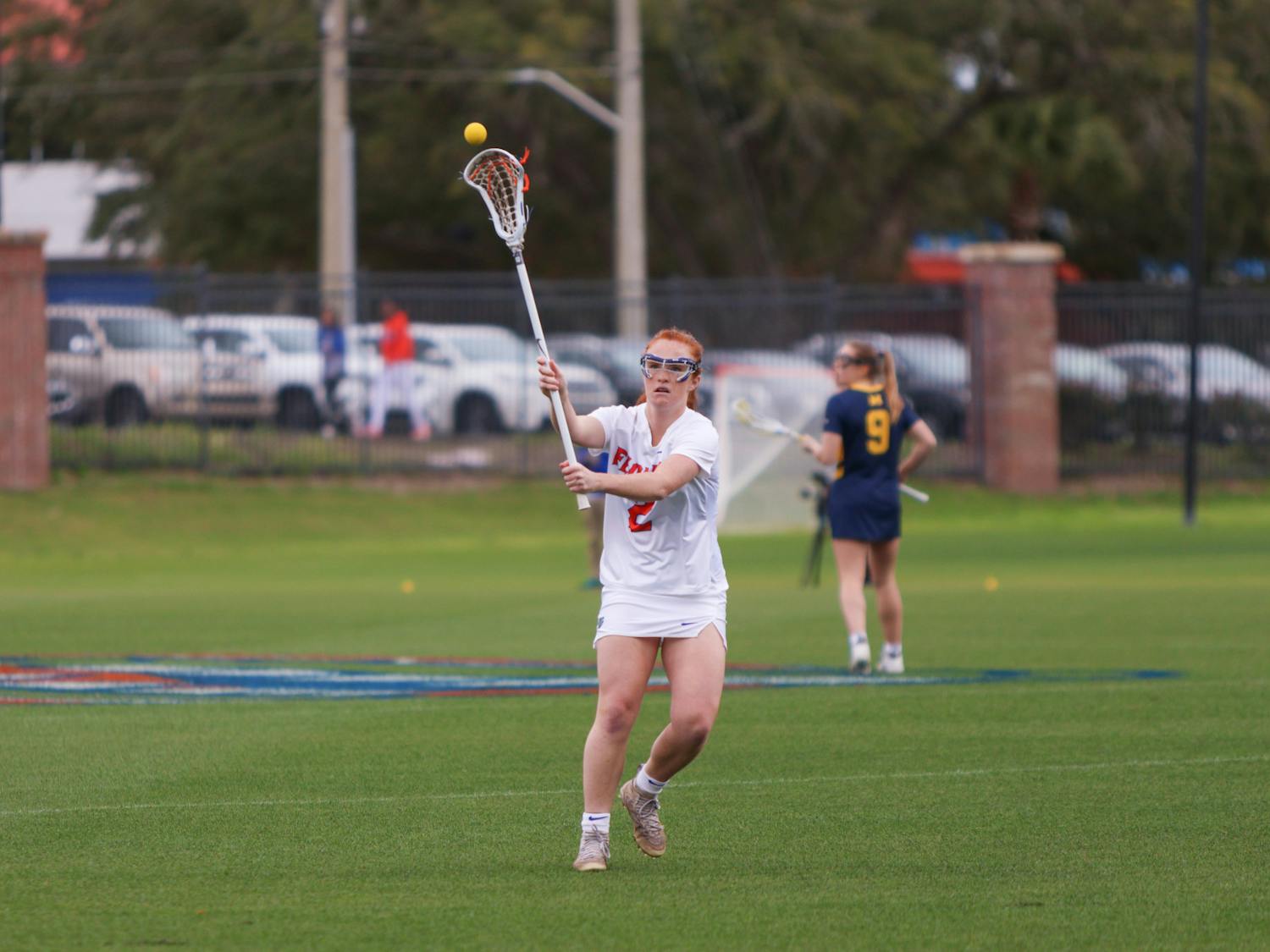 Florida midfielder Madison Waters throws the ball with her crosse during the Gators' 17-8 victory against the Michigan Wolverines, Sunday, Feb. 12, 2023. 